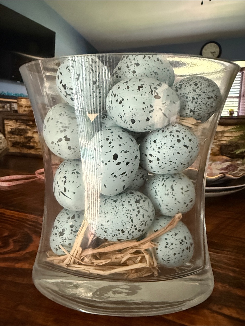 Speckled Decorative Eggs in Clear Glass Vase
